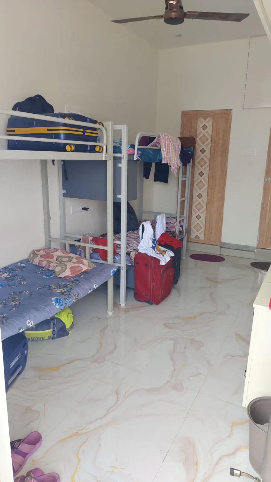 Sharing room with cots and cupboards at KPR Nest