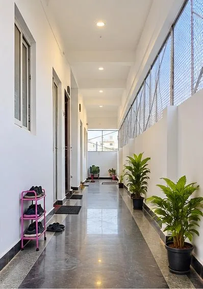 Bright corridor outside the rooms at Nilaa Stay